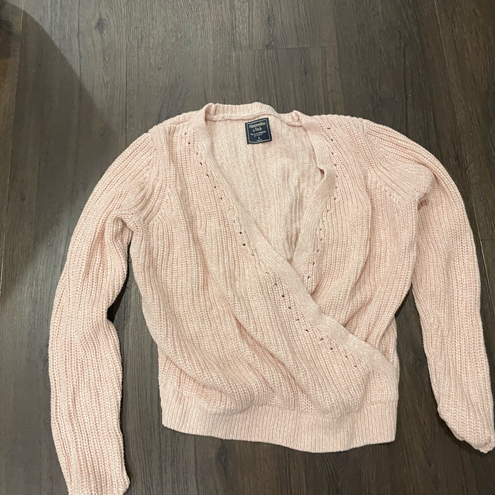 Women’s pink sweater.